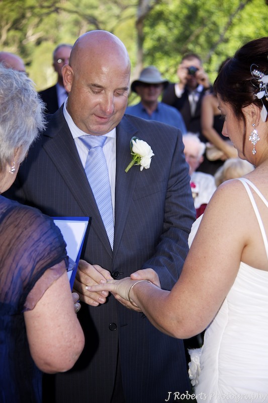 Groom giving bride ring - wedding photography sydney